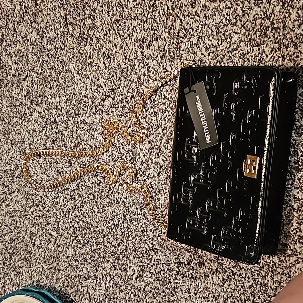 Pretty little thing. Black purse. New with tag